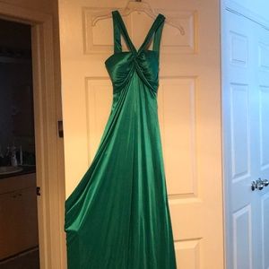 Long green gown with open back.